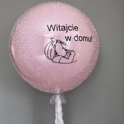 Duży szklany balon na powitanie dziecka w domu